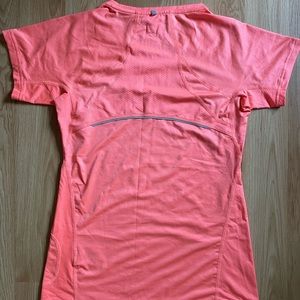 Coral sportswear top with silver detailing